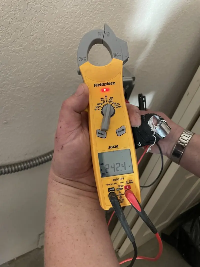 Voltage testing with clamp meter during Ceiling Fan Installation in Villa Hills